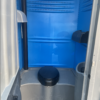Inside view of Grey Blue Outhouse Portable Toilet with Flush and Sink for Sale