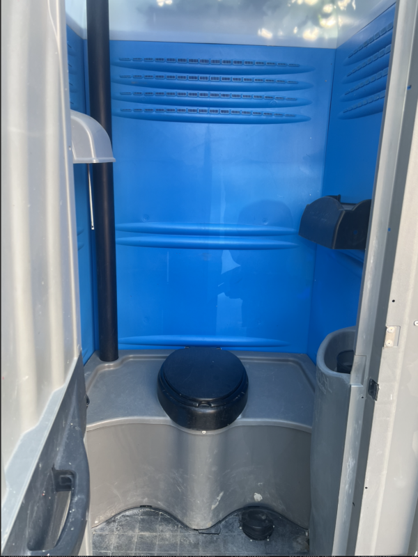 Inside view of Grey Blue Outhouse Portable Toilet with Flush and Sink for Sale